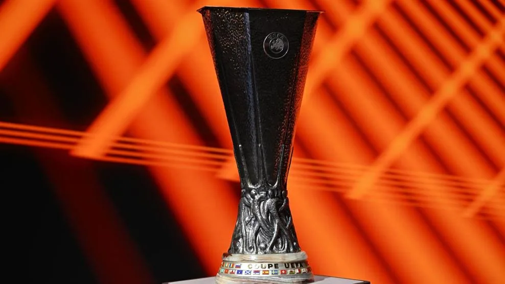 The UEFA Europa League trophy against the competition's orange backdrop