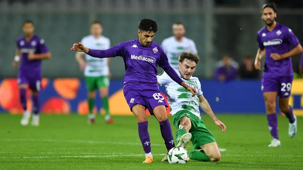 Fiorentina and The New Saints players contest the ball in a Conference League match